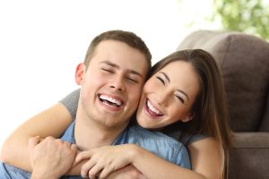 Happy couple with white smile at home sf oral surgery sf oral surgery