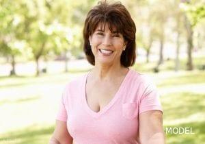 Smiling Woman in Pink Shirt Outdoors