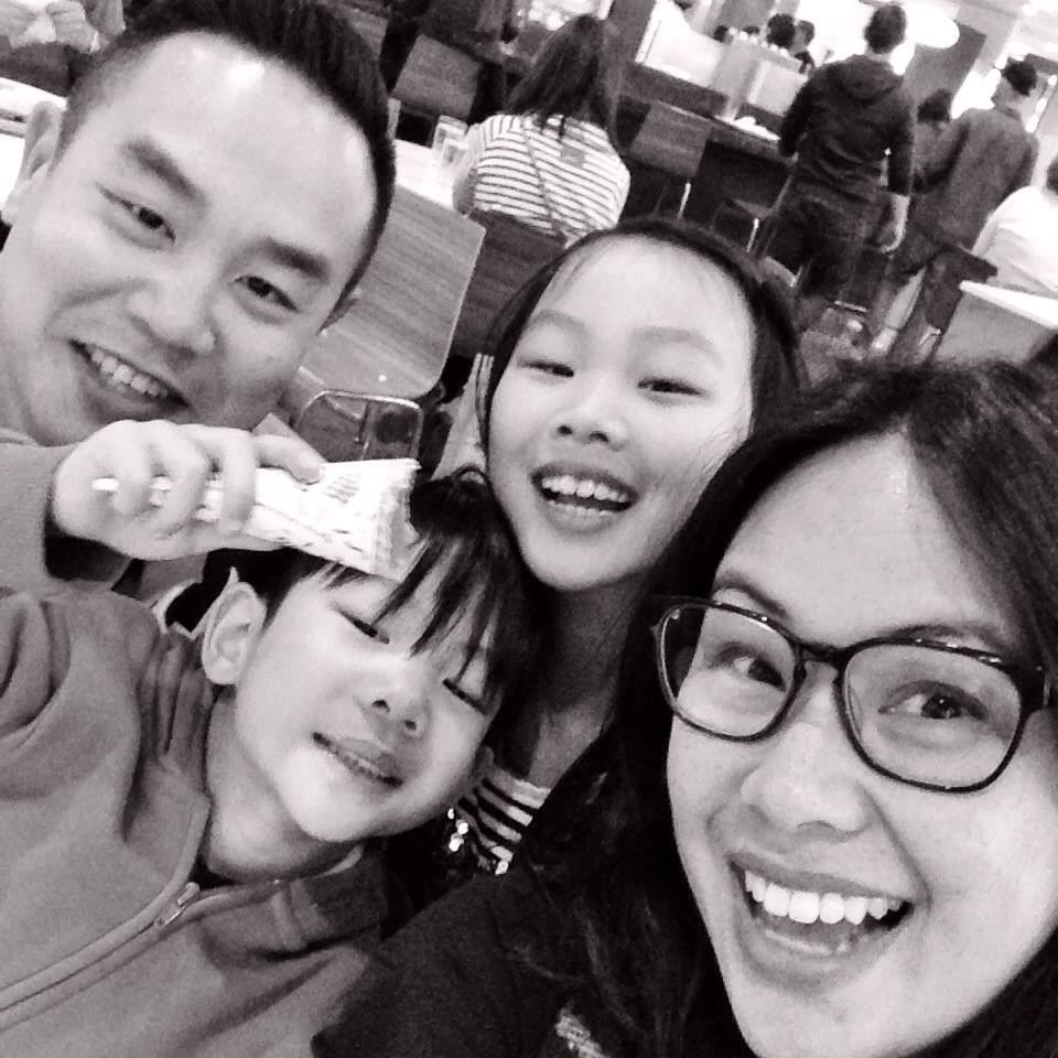 dr. Michael chan with his family in black and white