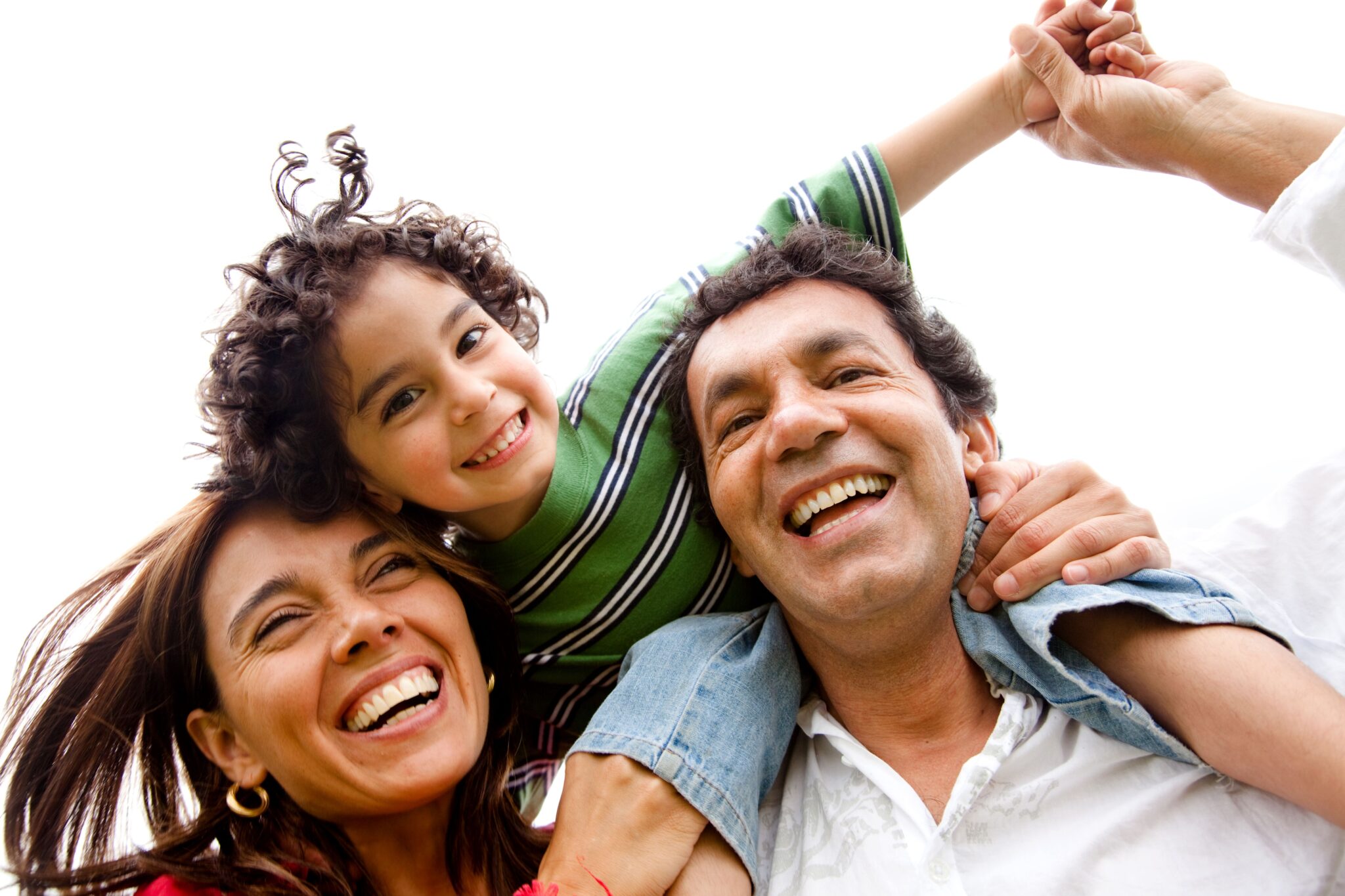 happy latino family laughing with child with curly hair