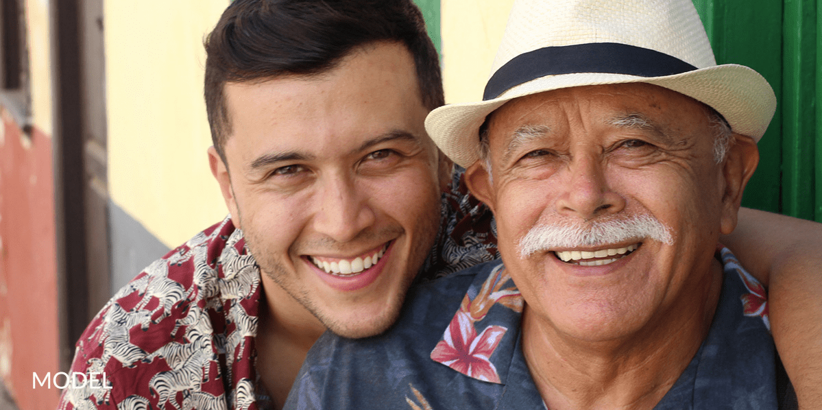 Young Man With Arms Around His Grandfather
