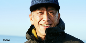 Smiling Mature Male in Blue Hat and Jacket
